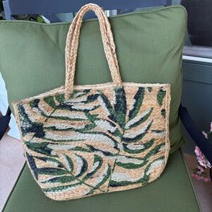 Natural Woven Capri JuteTote with Green Leaf Design with a Shimmer of Silver